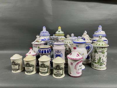 many different types of coffee pots and mugs on the table