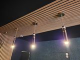 three lights that are hanging from the ceiling in the room
