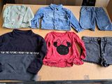 a lot of clothes that are on a table