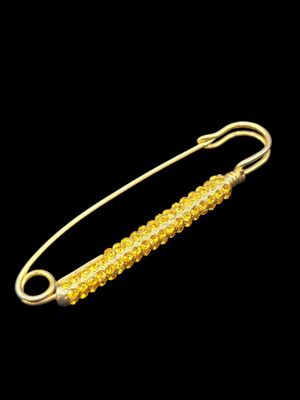 SONIA RYKIEL. Broche-barrette en métal doré.