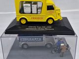 a yellow truck that is sitting in a clear case
