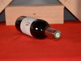 a bottle of wine that is sitting on a table