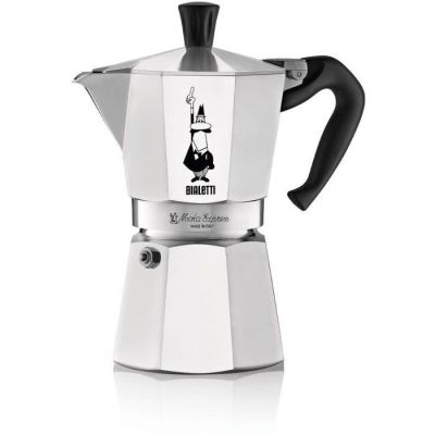 a close up of a stove top coffee maker on a white surface