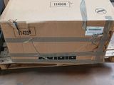 a cardboard box sitting on a pallet in front of a window