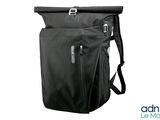 the back of a black backpack with a zipper on it