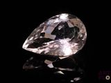 a close up of a diamond on a black surface