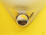 a close up of a yellow object on a yellow surface