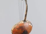a bird that is sitting on top of a wooden object