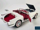 a white car with a red interior and a black roof