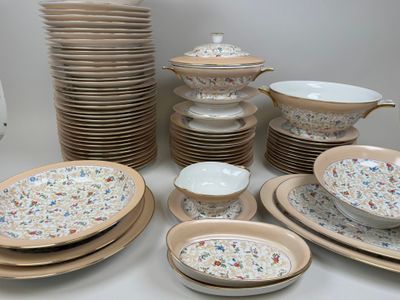 a lot of plates and bowls that are on the table