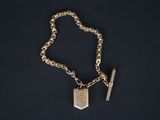 a close up of a chain with a key on it