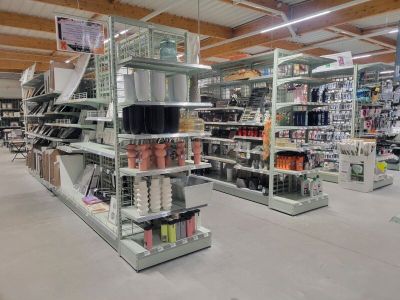 many shelves in the store that have various items on them