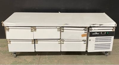 an image of a white refrigerator with six drawers on wheels