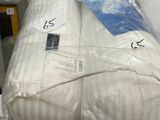 two pillows stacked on top of each other on a table