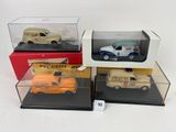 four different models of toy cars in display cases on a white surface