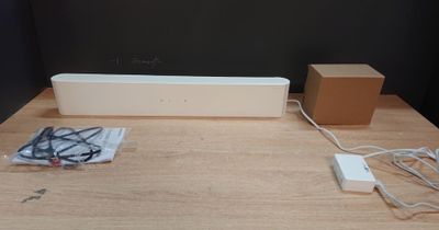 an image of a table with a speaker and a box on top of it