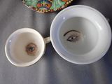 a cup with a picture of a woman ' s face in it