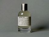 an image of a bottle of perfume sitting on a table