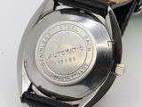 an image of a close up of a wrist watch on a table