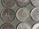 six different types of coins are shown on a table