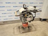 a close up of a machine on a stand in front of a wall