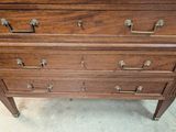 an image of a wooden dresser in a room