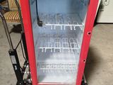 a red and white display case that is in a garage