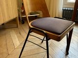 a chair that is sitting in a room with wood floors