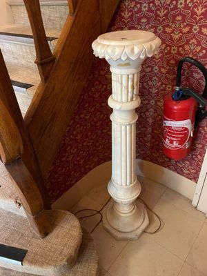 a fire extinguisor on the floor next to the stairs