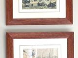 two framed pictures on the wall of a living room