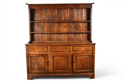 an old wooden cabinet with drawers and drawers on top of it