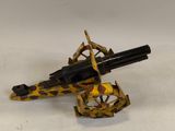 une image représentant un pistolet jouet posé sur une surface blanche
