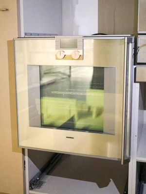 an oven that is built into the wall in the kitchen