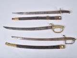 four different types of knives are displayed on a white surface