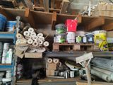 many rolls of paper on the shelves in the garage