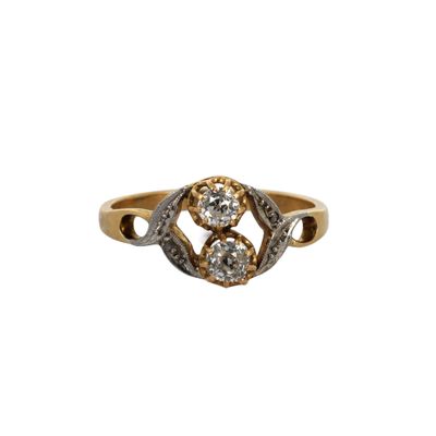 an image of a gold and diamond ring on a white background