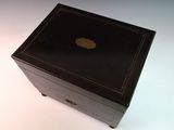 a black box with a gold apple logo on it