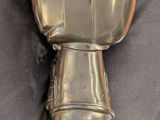 a metal object that is on a black surface