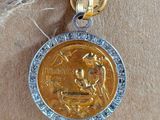 an image of a gold and silver medal with a bird on it