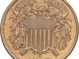 a close up of a coin with an eagle and shield on it