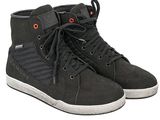 a pair of black shoes with red eyes on a white background