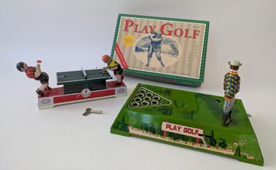 a box of play golf and a toy train on the table