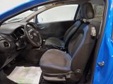 the interior of a small blue car with black seats and a steering wheel