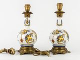 two vases that are sitting on a table