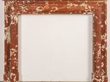 an image of a fireplace with a white wall and brown paint on it