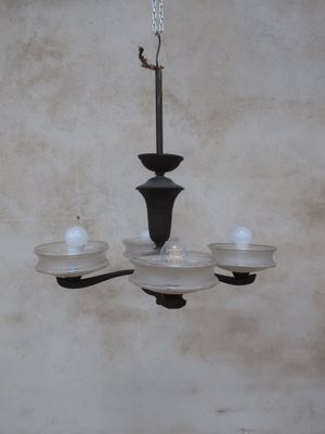 a chandelier hanging from the ceiling in a room