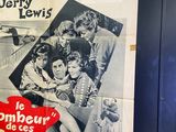 a poster on the wall of a room with pictures on it