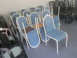 many chairs in a room with a lot of them