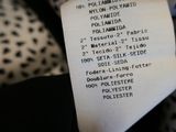 a person holding a piece of paper with a list on it