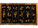 an image of a black and gold room divider with flowers and vases on it